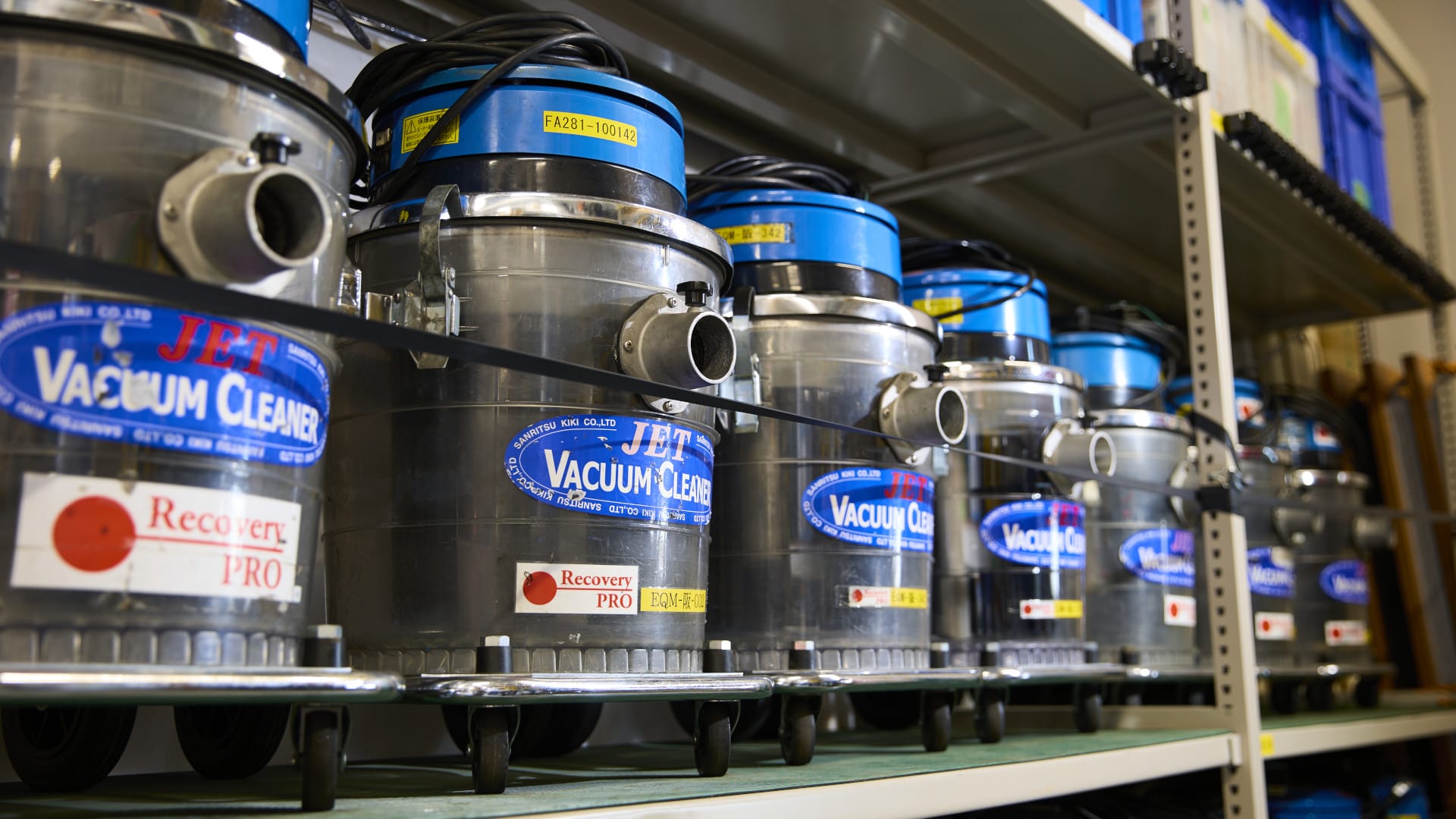 Shelf filled with vacuum cleaners