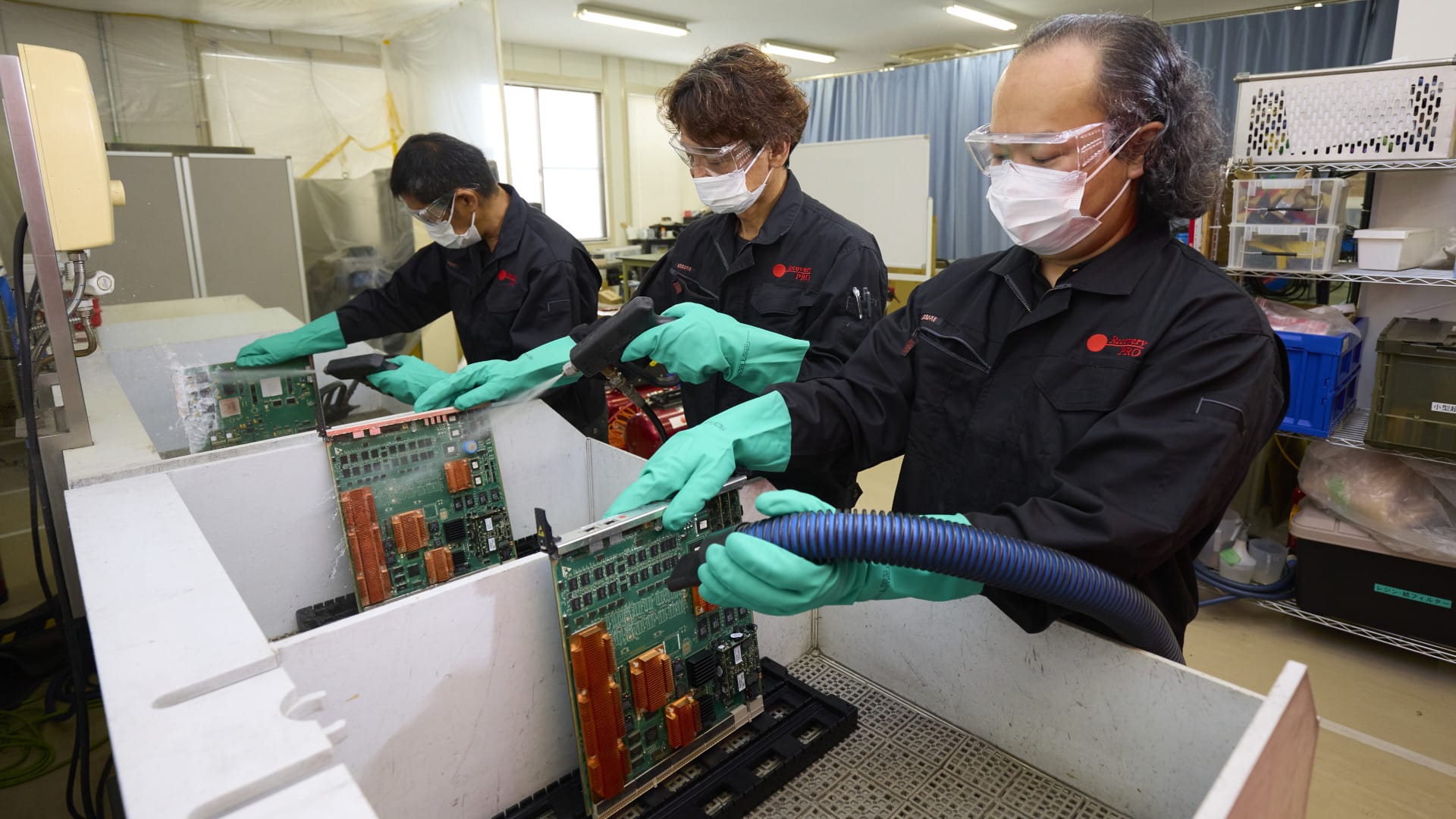 RecoveryPRO workers cleaning PCBs